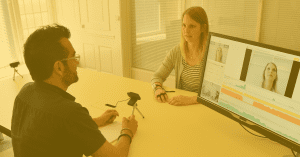 Participant and researcher during a facial expression analysis experiment