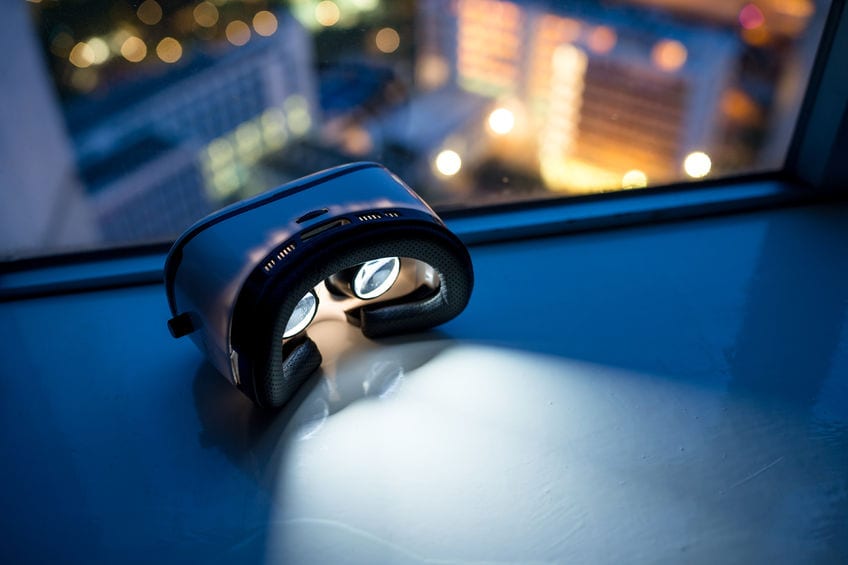 virtual reality headset by a window in a tall building