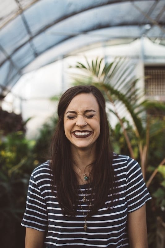 girl smiling with her eyes closed