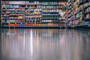 lower view in a supermarket with products on the shelves