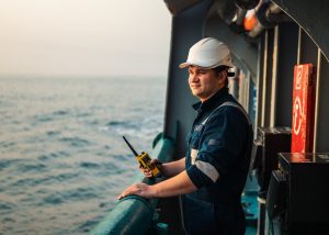 Marine engineer on the deck of a large ship