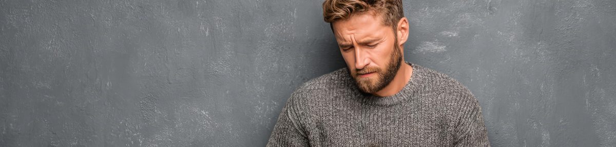 Yawn and Pain: man with a pained expression 